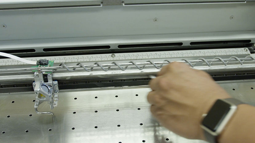 Running a cotton swab along the top of the bearing rail.