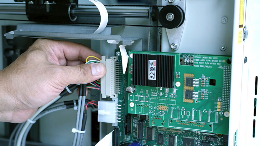 Removing the controller board's top connector.