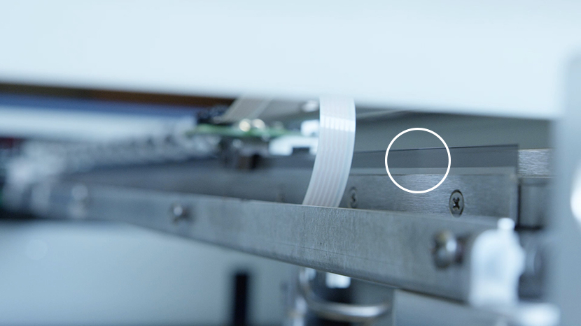 Close-up of the linear encoder strip.