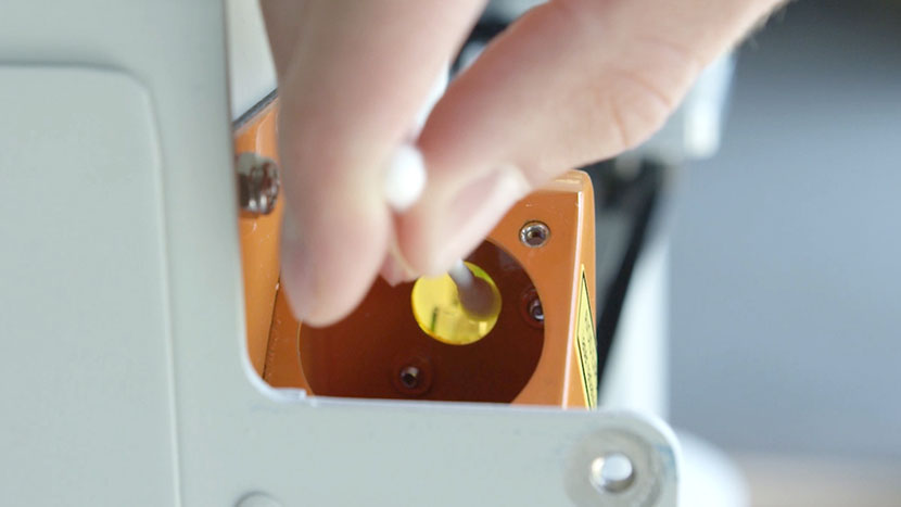 Cleaning the inside of the window at the top of the periscope.