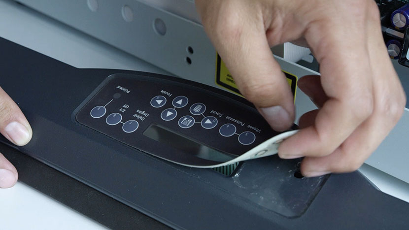 Peeling the keypad off the front of the bezel