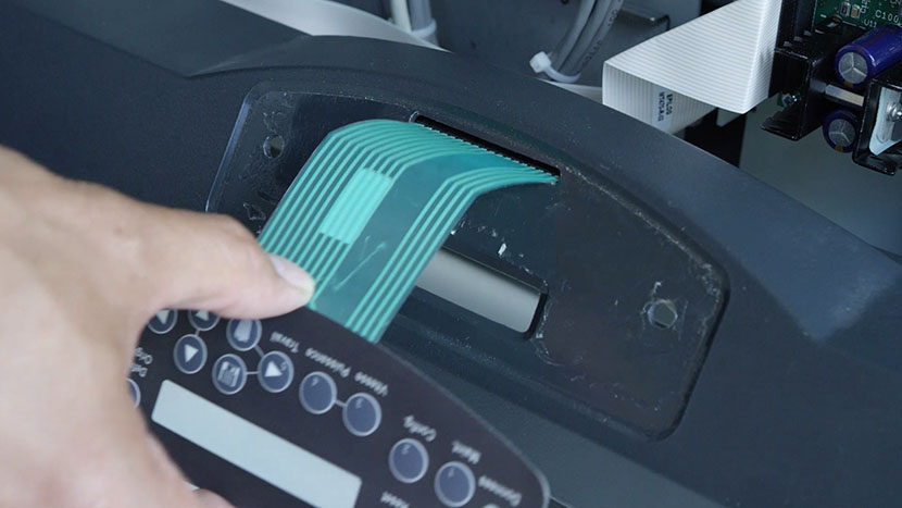 Inserting the new keypad's connector through the bezel