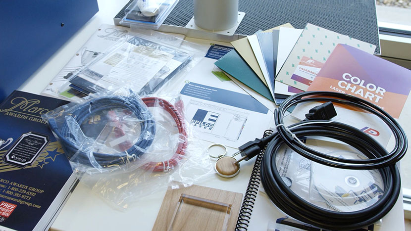 The items included with the machine layed out on a table.