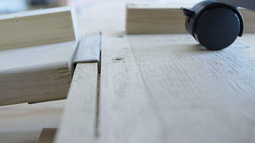 Close up of a wheel ramp in position on the side of the pallet.