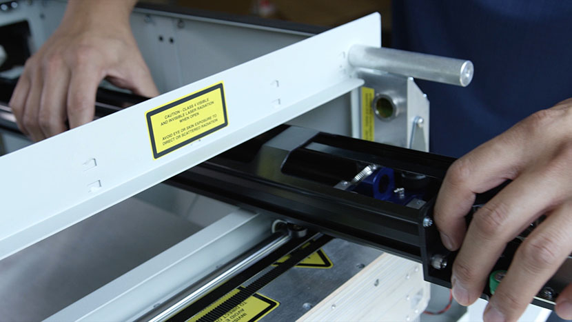 The x-axis assembly part-way out of the machine.