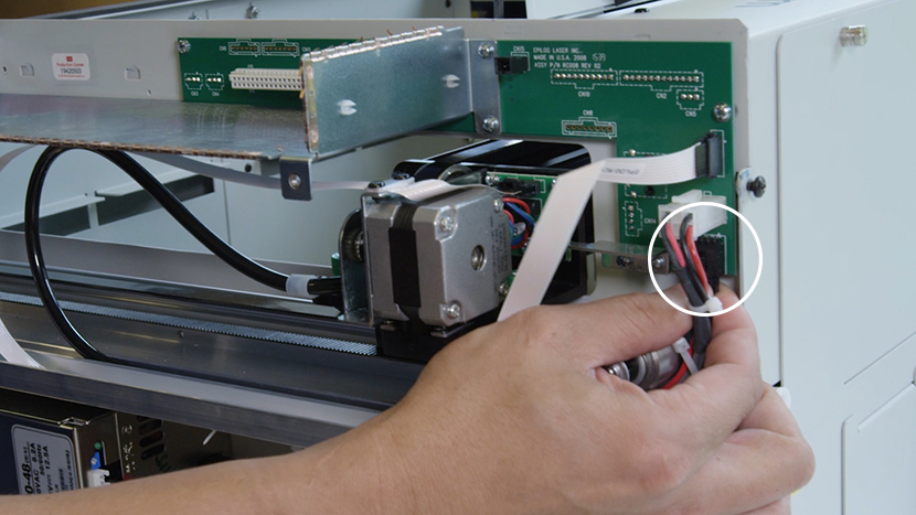 Disconnecting the wire harness from the backplane board.